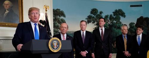 U.S. President Donald Trump, flanked by ?Commerce Secretary Wilbur Ross, U.S. Trade Representative Robert Lighthizer, White House Homeland Security Advisor Tom Bossert, Assistant to the President Peter Navarro and Deputy Assistant to the President for International Economic Affairs Everett Eissenstat, delivers remarks before signing a memorandum on intellectual property tariffs on high-tech goods from China, at the White House in Washington, U.S. March 22, 2018. REUTERS/Jonathan Ernst - RC153113ADA0