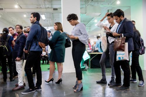 Job seekers and recruiters gather at TechFair in Los Angeles, California, U.S. March 8, 2018. REUTERS/Monica Almeida - RC12BE16F330