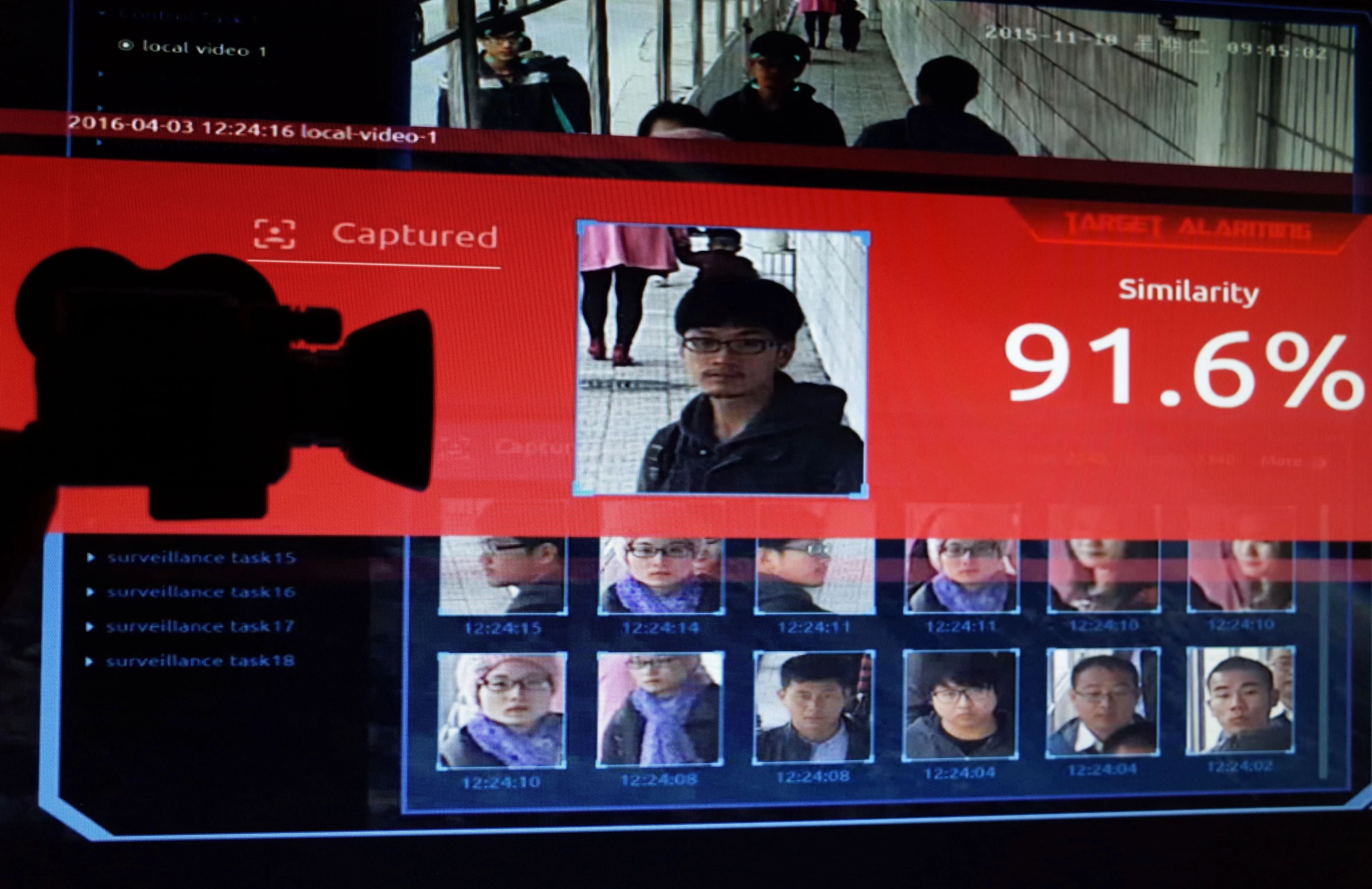 February 05, 2020:  Illustration of China's facial-recognition technology with the silhouette of a mock video camera in front of screen grabs taken from a promotional video by SenseTime. SenseTime is a Chinese artificial intelligence company whose SenseFace software is specialised in facial recognition.
Photo d'illustration de la technologie de reconnaissance faciale en Chine.NO USE FRANCE