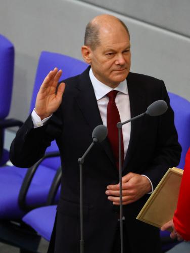 Newly elected German Chancellor Olaf Scholz is sworn-in by Parliament President Baerbel Bas during a session of the German lower house of parliament Bundestag, in Berlin, Germany, December 8, 2021. REUTERS/Fabrizio Bensch