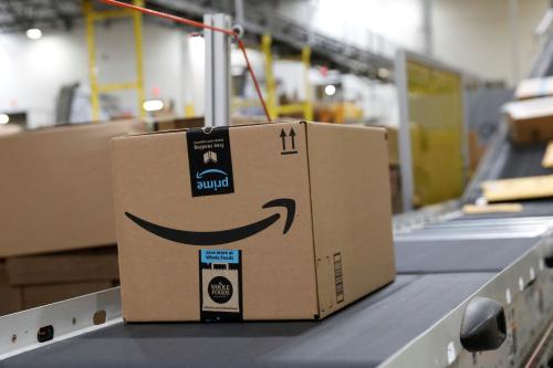 Packaged merchandise is seen on a conveyer belt at the Amazon fulfillment center