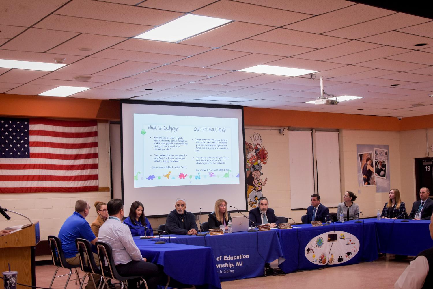 In the middle, district superintendent Laura Winters, board attorney Michael Inzelbuch (Winter's left), board member Heriberto Rodriguez (Winter's right) along with school administration staff.Jcc 8064