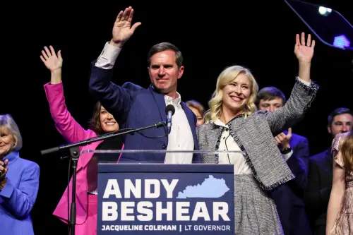 Kentucky Governor Andy Beshear waves with his wife Britainy Beshear and Lt. Gov. Jacqueline Coleman, at left, after winning a second term as Kentucky's Governor during a post election party in Louisville, Kentucky, U.S. November 7, 2023. Matt Stone/USA Today Network via REUTERS.