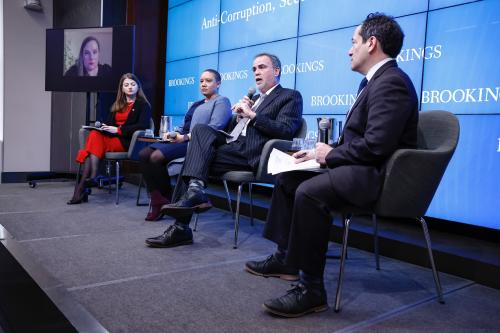 Jonathan Katz moderates a panel discussion