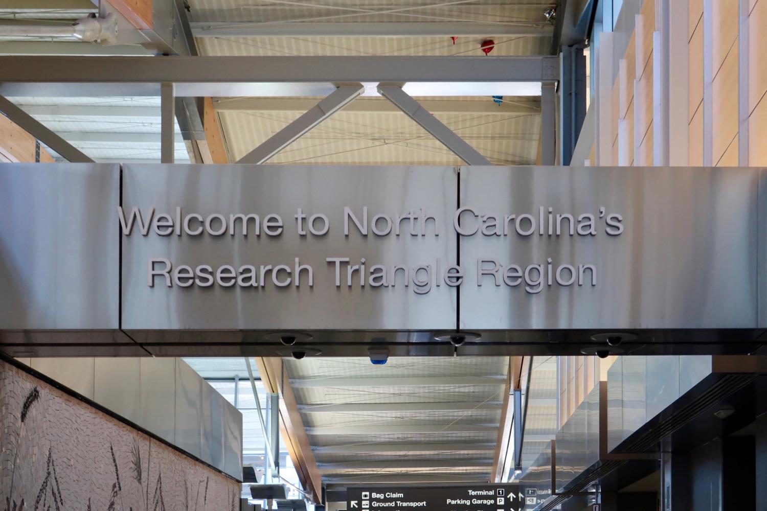 DURHAM, NC, USA - DECEMBER 24, 2019: WELCOME TO NORTH CAROLINA’S RESEARCH TRIANGLE REGION sign at RDU International Airport