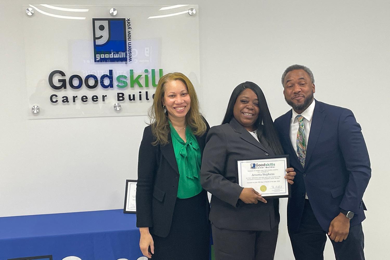 Empire State Development President Hope Knight and New York State Department of Civil Service President Timothy Hogues present March 2024 Goodskills Career Builder graduate Arnetta Stephens with her completion certificate. Image courtesy of Goodwill Industries of WNY.