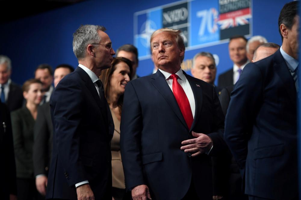 NATO Secretary General Jens Stoltenberg and U.S. President Donald Trump attend the annual NATO heads of government summit at the Grove Hotel in Watford, Britain December 4, 2019.