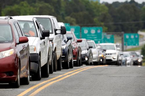 Scores of vehicles line up to enter a gasoline station as demand for fuel surges following the cyberattack that crippled the Colonial Pipeline, in Durham, North Carolina, U.S. May 12, 2021.