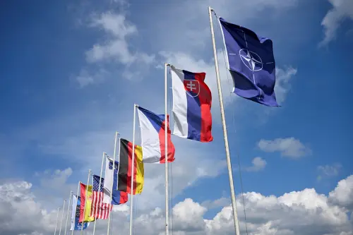 Flags flutter on the day of the NATO multinational battle group military exercise 'Joint Allied Power Demonstration Day', at a military training area in Lest, near Zvolen, Slovakia April 25, 2024.