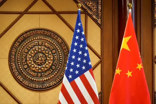 U.S. and Chinese flags sit in a room where U.S. Secretary of State Antony Blinken met with Chinese Minister of Public Security Wang Xiaohong at the Diaoyutai State Guesthouse, April 26, 2024, in Beijing, China.