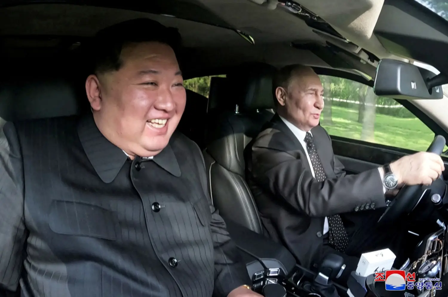 Russia's President Vladimir Putin and North Korea's leader Kim Jong Un ride an Aurus car in Pyongyang, North Korea in this image released by the Korean Central News Agency June 20, 2024.