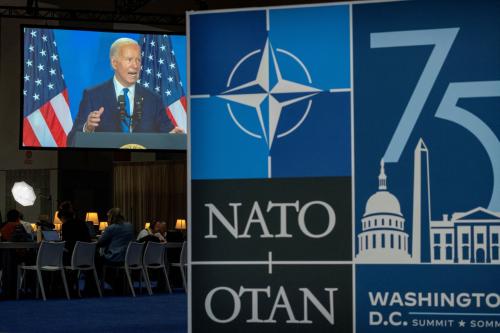 U.S. President Joe Biden is seen speaking on a screen in the press media center during NATO's 75th anniversary summit in Washington, U.S., July 11, 2024. REUTERS/Ken Cedeno