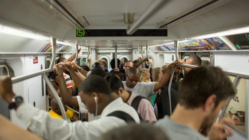 NEW YORK - JULY 14, 2014: passengers on MTA subway train in New York. The NYC Subway is a rapid transit/transportation system in the City of NY.
