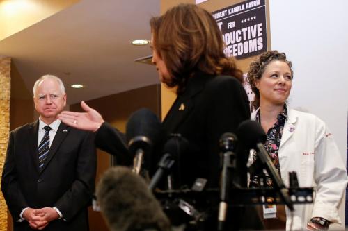 U.S. Vice President Kamala Harris speaks next to Minnesota Governor Tim Walz during a visit to the St. Paul Health Center, a clinic that performs abortions, in St. Paul, Minnesota, U.S., March 14, 2024.