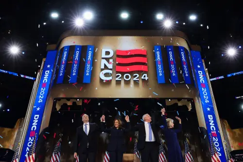 Democratic presidential nominee and U.S. Vice President Kamala Harris, her husband Doug Emhoff, Democratic vice presidential nominee Minnesota Governor Tim Walz, and his wife Gwen stand on stage on Day 4 of the Democratic National Convention (DNC) at the United Center in Chicago, Illinois, U.S., August 22, 2024.