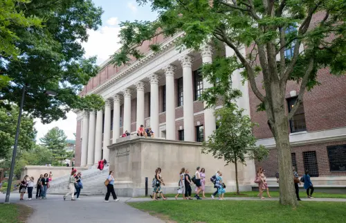 Students outside the library of a prominent institution of higher learning