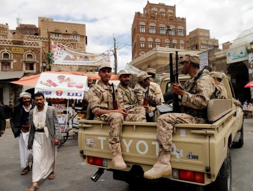 Shi'ite Houthi rebels in army uniform patrol Yemen's downtown Sanaa, in a vehicle they have recently taken from the army, October 8, 2014.