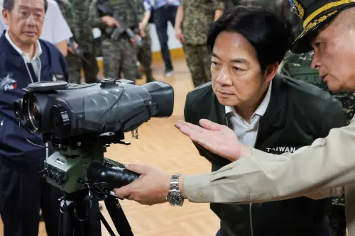 Taiwan President Lai Ching-te studies a Laser rangefinder during his visit to a military camp in Taoyuan, Taiwan May 23, 2024.