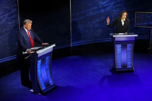 Democratic presidential nominee, U.S. Vice President Kamala Harris speaks during a presidential debate hosted by ABC as Republican presidential nominee, former U.S. President Donald Trump listens, in Philadelphia, Pennsylvania, U.S., September 10, 2024.