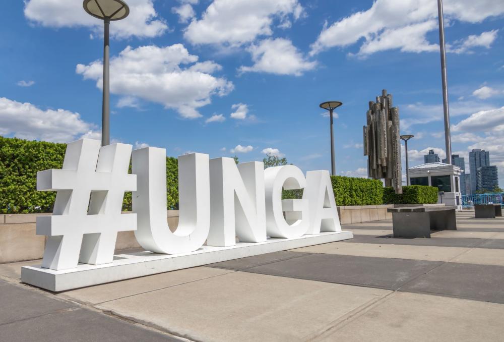 The hashtag of the United Nations General Assembly (UNGA) on display outside the U.N. Headquarters in New York City, USA. Shutterstock/jrtwynam