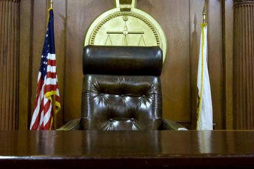 Empty courtroom judge chair.