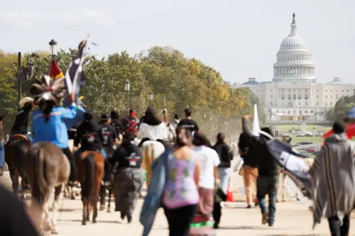 Members of the Muwekma Ohlone Tribe of the San Francisco Bay Area, along with other tribal groups and their supporters, march along the National Mall in Washington, D.C. on horseback on Indigenous Peoples' Day, October 14, 2024. The demonstrators rode across the country on horseback as part of the protest titled the "Trail of Truth," arriving in Capitol Hill to demand federal recognition for Indigenous tribes.